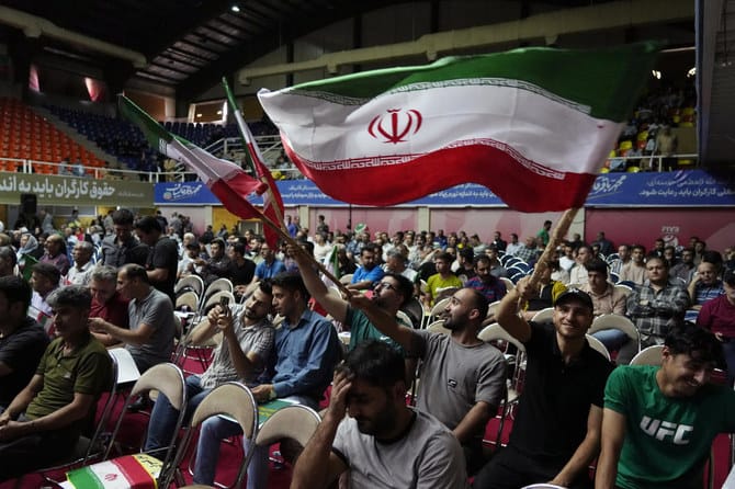 Iranians split on presidential vote as hardships mount