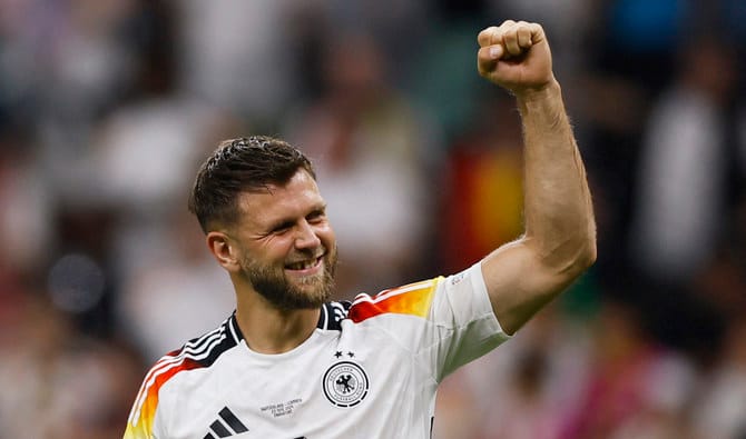 Last-gasp Fuellkrug goal rescues top spot for Euro hosts Germany