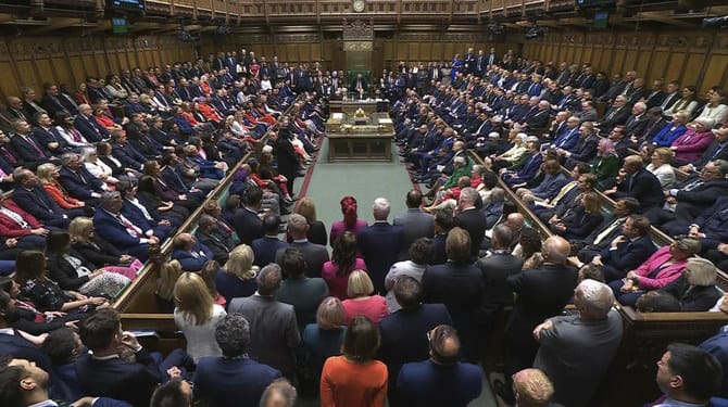 Labour ministers in government seats as UK parliament returns