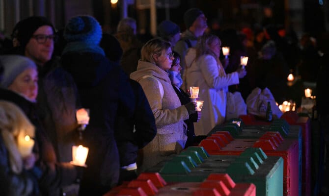 German president urges unity after ‘dark shadow’ of Christmas market attack