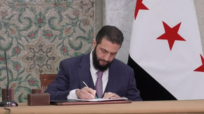 Syrian leader signs constitutional declaration, hailing ‘new history’