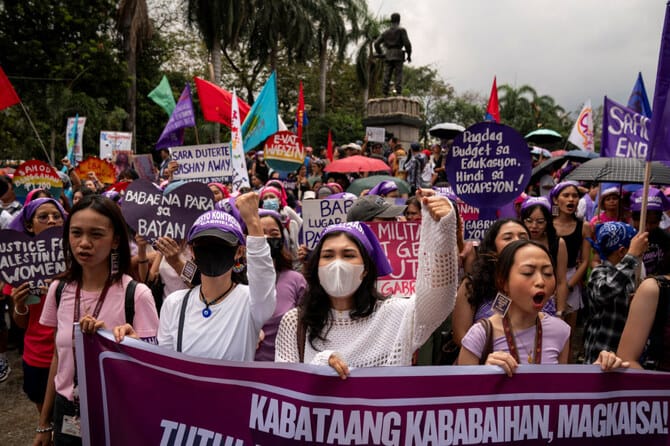 Protesters rally on International Women’s Day, fearing far right