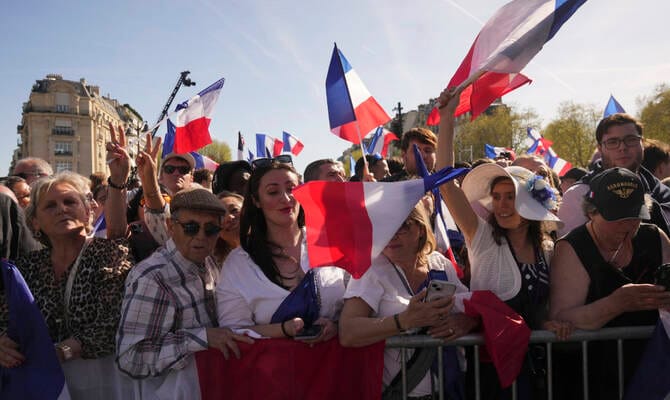 Le Pen supporters rally in Paris, turning a protest into a populist show of force