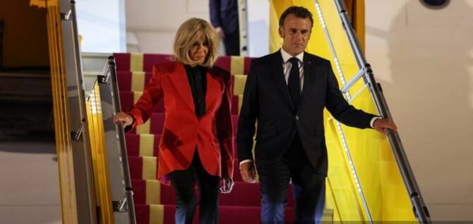 Macron’s office downplays plane incident with wife