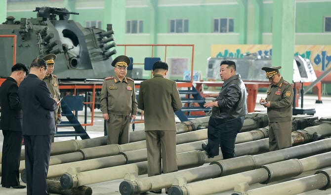 North Korea’s Kim Jong Un inspects munitions plants, lauds increased shell production