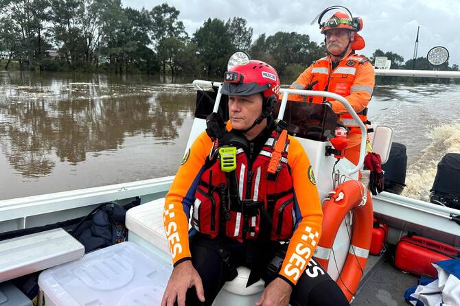 Flood victims stranded on roofs as downpours lash eastern Australia