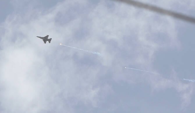 Israel carries out strikes on two Syrian cities, Syrian state news agency says