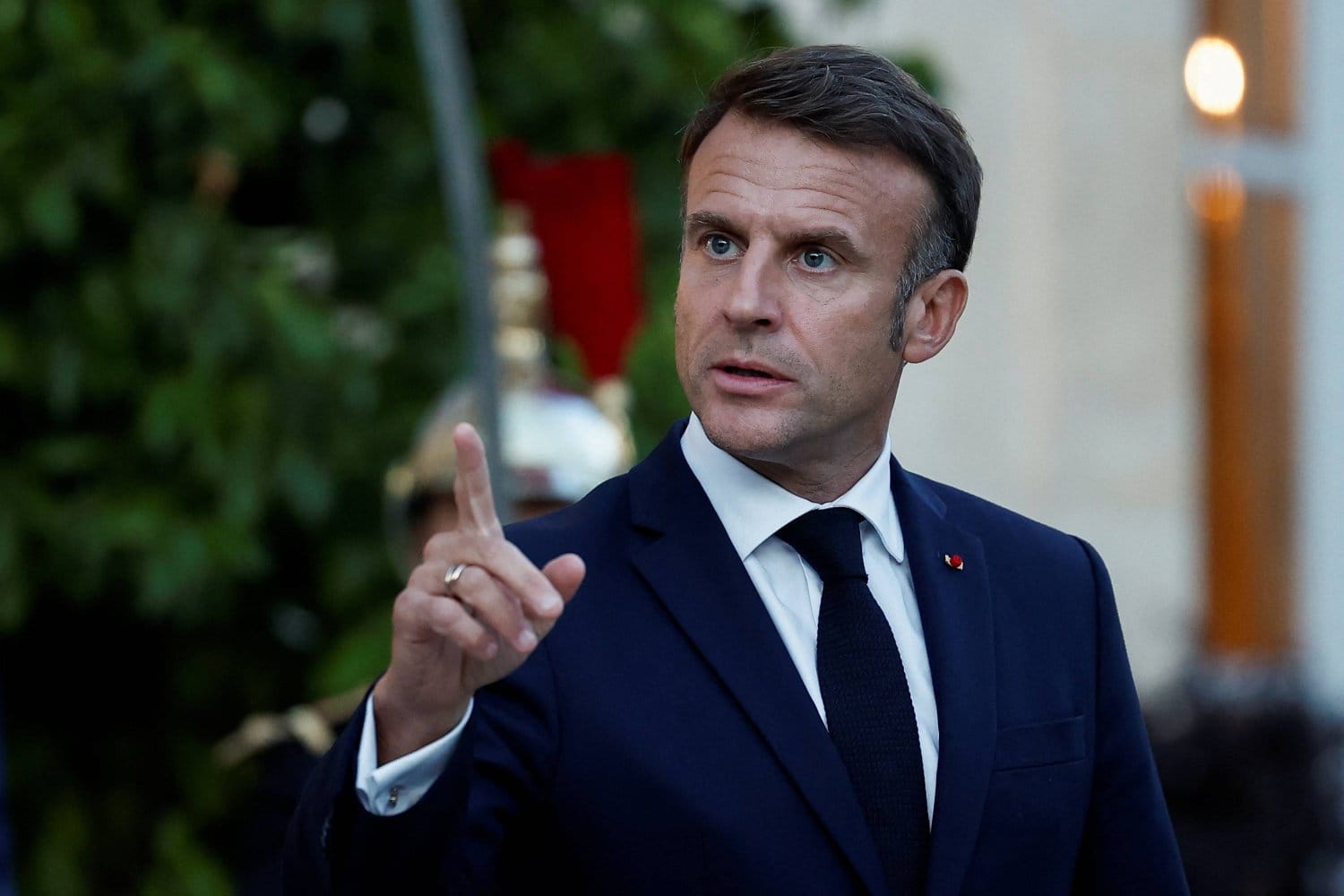 Macron urges end to strikes against civilians, warns against Iran regime change