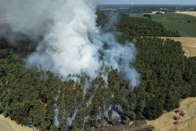 Wildfire kills 2 people in Spain as parts of Europe bake in heat wave