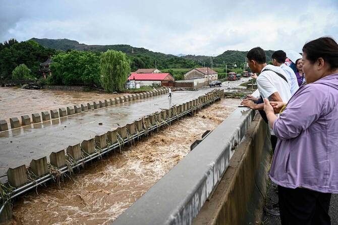 Four dead, eight missing in China landslide after heavy rain