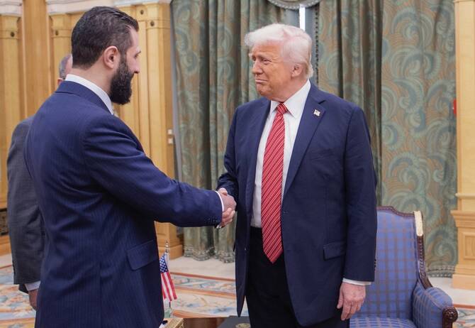 Trump signs an executive order ending US sanctions on Syria
