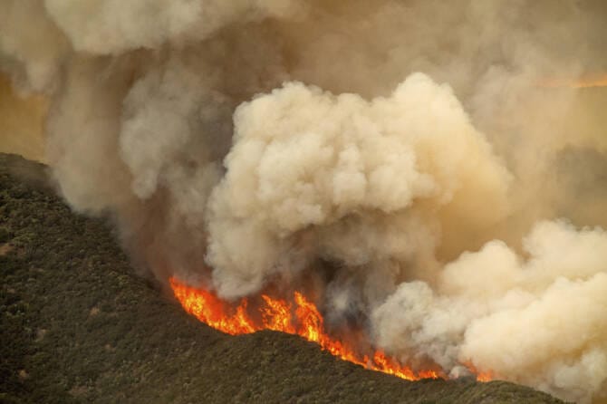 Massive wildfire in central California threatens homes, injures 3 people as it burns out of control