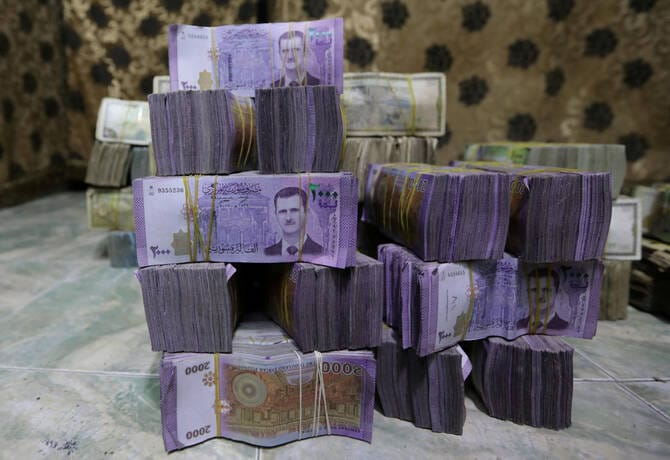 Syria to revalue currency, dropping two zeros in bid for stability, sources say