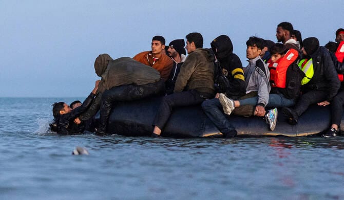 A boat carrying migrants sinks off the Libyan coast with at least 19 people dead and 42 missing