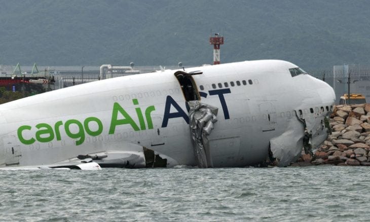 A cargo aircraft skids off a Hong Kong runway into the sea, killing 2 airport workers
