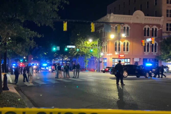 Gunmen kill two, injure 12 in a shootout in a crowd in Alabama capital city’s downtown