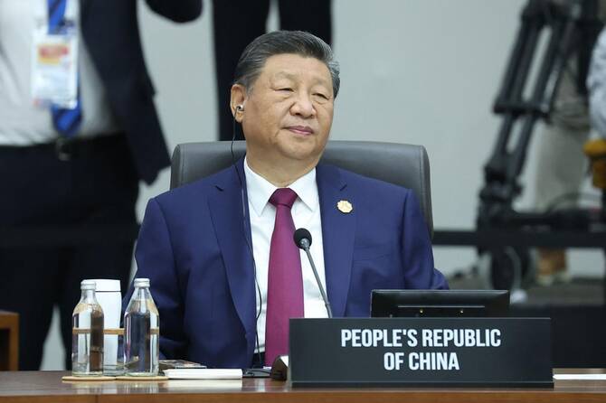 China’s Xi promises to protect free trade at APEC as Trump snubs major summit