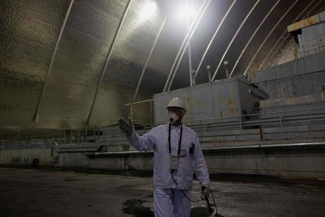 Inside Chernobyl, Ukraine scrambles to repair radiation shield