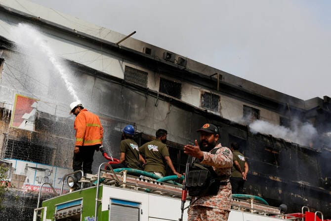 Death toll in Karachi shopping plaza fire rises to 10 as search continues for dozens missing