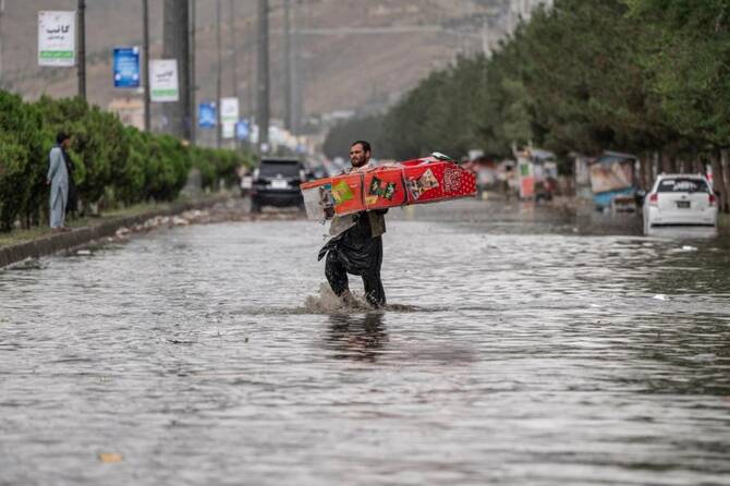 Flash floods triggered by heavy rains in Afghanistan kill at least 17 people