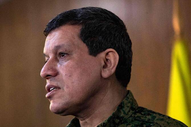 Syria Kurds impose curfew in northeast cities before govt deal begins