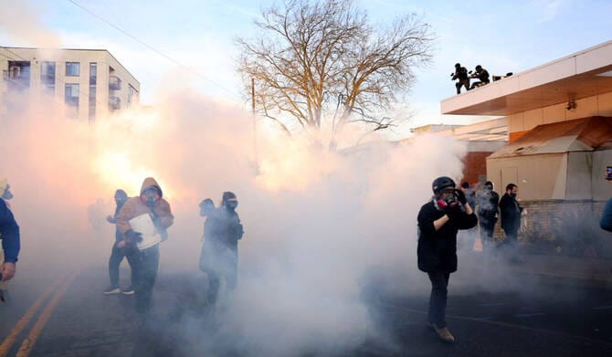 Federal agents must limit tear gas for now at protests outside Portland ICE building, judge says